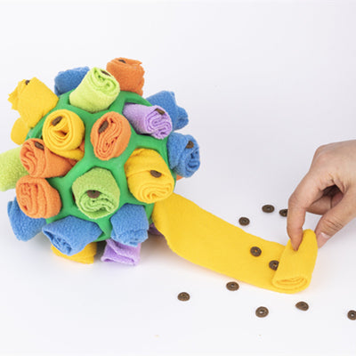 Red rubber pet sniff ball with pink, purple, and dark purple fleece rolls, featuring a treat-holding strap. - Image 16