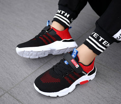 Boy's black and blue sports shoes with orange accents, mesh upper, white sole, blue laces, and a Velcro strap. - Image 21