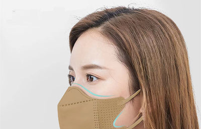 Peach disposable 3-layer face mask with perforated details worn by a person, offering comfortable daily protection. - Image 31