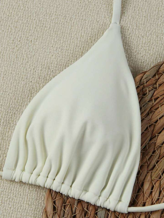 White women's bikini with triangle top and tie-side bottom, featuring a gold starfish charm on the center front. - Image 19