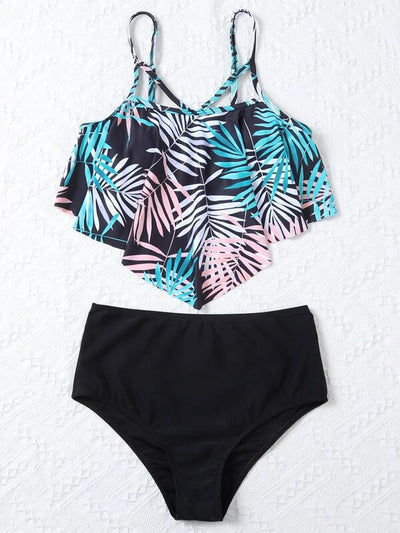 Women's split swimsuit with a black high-waisted bikini bottom and a flounced tankini top featuring a green, blue, and white tropical leaf print. - Image 21