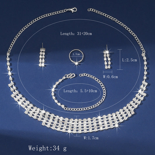Sparkling four-piece jewelry set with a rhinestone necklace, bracelet, drop earrings, and a simple band ring on a model. - Image 5