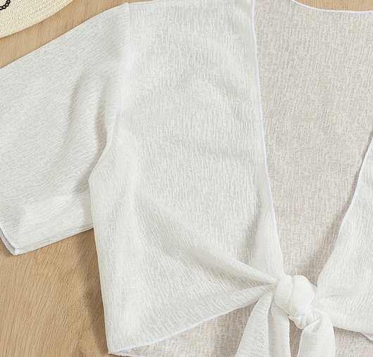 White two-piece swimwear set with a tie-front crop top and a high-waisted skirt with an asymmetrical ruffled hem. - Image 13