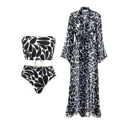 Woman in black and white floral print one-piece swimsuit with matching long-sleeved kimono cover-up and white belt. - Image 41