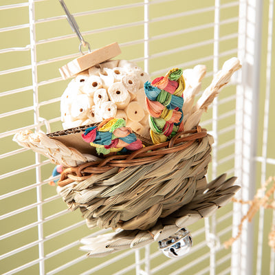 Colorful parrot bird toy with a woven basket base, braided chew sticks, crinkled paper, and a metal hanging chain. - Image 14