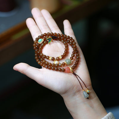 Pulsera de Tres Aros con Perla de Calabaza y Mariposa - Image 10