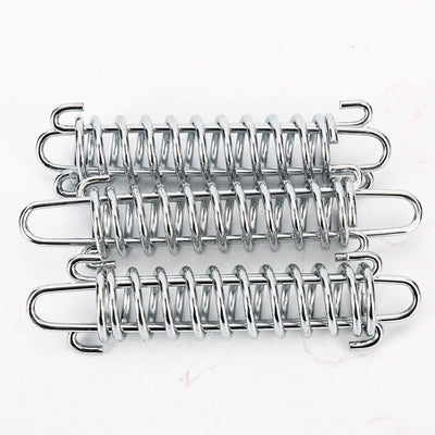 Silver metal compression spring with hooks, packaged in a clear plastic bag, for dog chains or pet leashes.