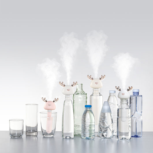 White and clear columnar mini humidifier with a cute bird-shaped top, featuring rose gold beak and tail accents. - Image 8