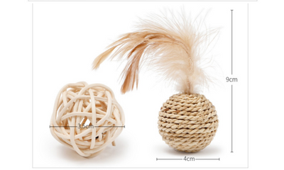 Two natural cat toys: a woven rattan ball and a braided grass ball with light brown feathers. - Image 6