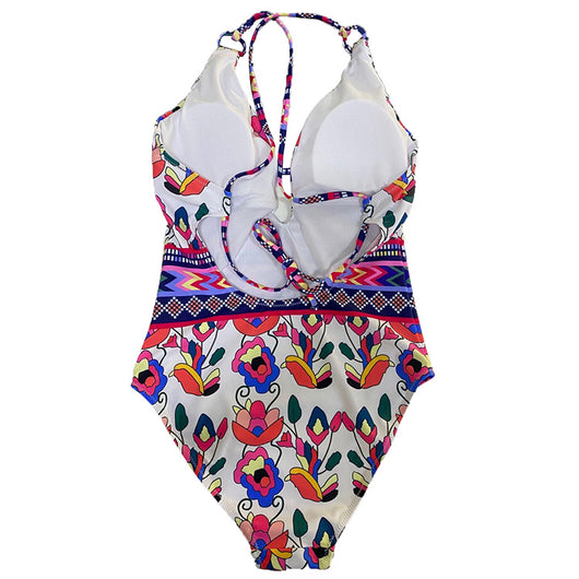 Vibrant floral and geometric one-piece swimsuit with a V-neck, keyhole detail, and criss-cross back straps. - Image 7
