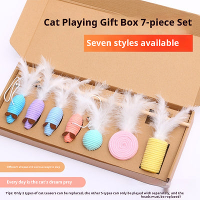 7-piece cat toy gift set with mouse, feather wands, and string-wrapped toys in a brown cardboard box. - Image 3