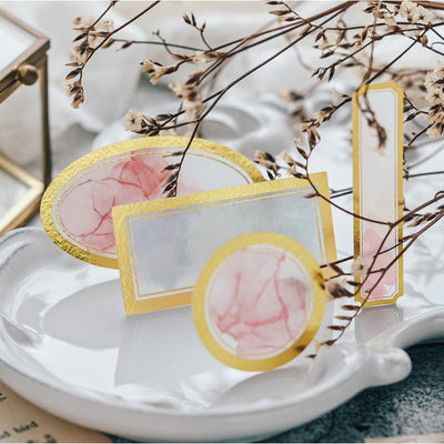 Assorted decorative paper labels with gold foil borders and soft watercolor designs in pink, blue, and green hues. - Image 6