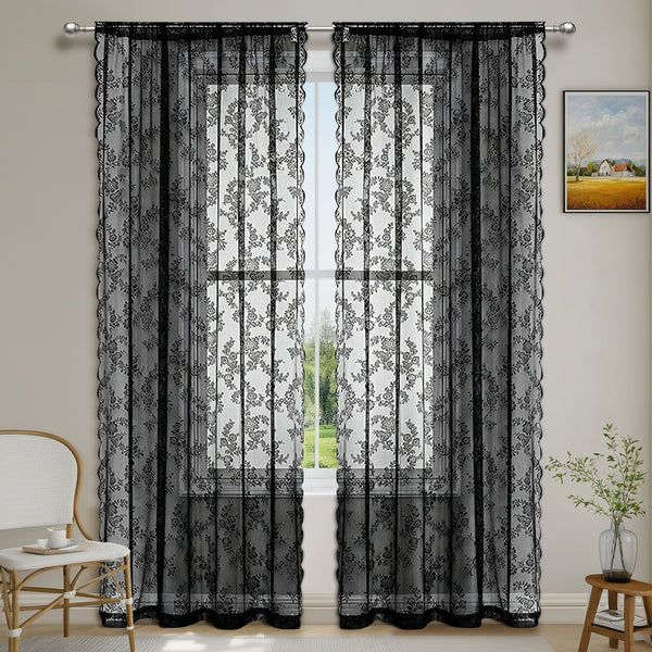 Red lace sheer curtains with a floral pattern and scalloped edges, hung on a black curtain rod.