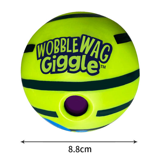 Wobble Wag Giggle dog sound ball, white with green stripes, in blue packaging highlighting glow-in-the-dark feature. - Image 10