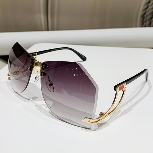 Rimless sunglasses with gradient pink lenses and gold-tone hollow temples, featuring a unique quadrilateral shape.