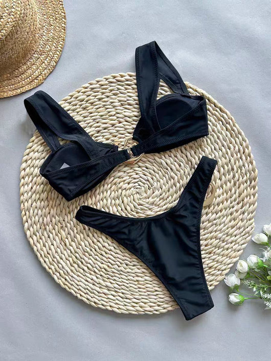 Black one-piece swimsuit with asymmetrical cutout design and gold-toned ring details, featuring a high-cut bottom. - Image 7
