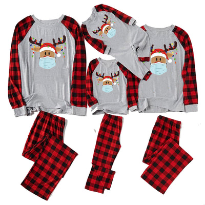 Matching family Christmas pajamas with grey tops, red plaid sleeves, and a reindeer wearing a Santa hat and face mask. - Image 3