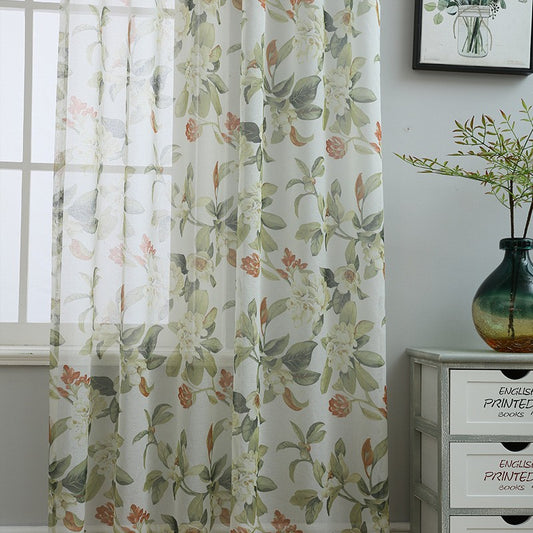 Dark gray semi-sheer curtains with a white and green floral pattern, hung on a black rod in a living room. - Image 2