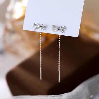 Aretes de Moño Elegante con Borla Larga