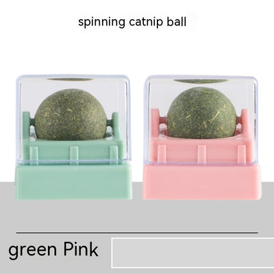Two spinning catnip balls, one with a green base and one with a blue base, in clear plastic cases. - Image 5