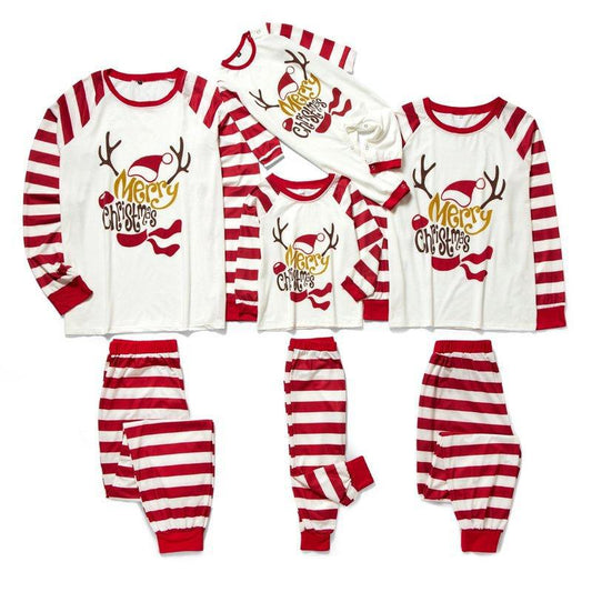 Matching navy blue family Christmas pajamas with white Christmas tree and "Merry Christmas" text, paired with patterned bottoms. - Image 2