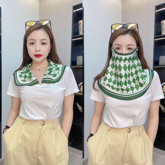 Female cream and black floral polka dot sun protection mask with ear loops, designed for eye corner protection. - Image 9