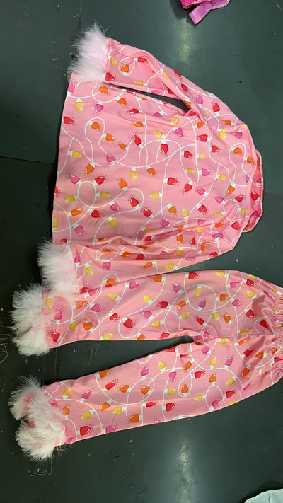 Young girl in a leopard print pajama set with black feather trim on the cuffs and ankles, wearing a pink glitter headband. - Image 21