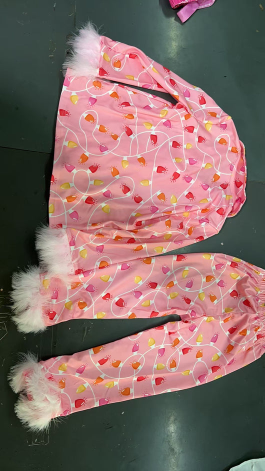 Young girl in a leopard print pajama set with black feather trim on the cuffs and ankles, wearing a pink glitter headband. - Image 21