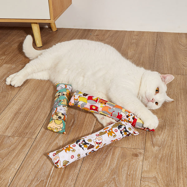 Dark blue catnip pillow toy with white cat, fish, and paw print patterns, measuring 25cm long.