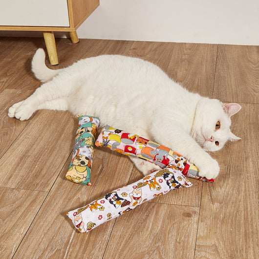 Dark blue catnip pillow toy with white cat, fish, and paw print patterns, measuring 25cm long.