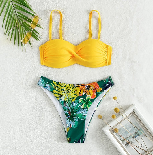 Blue bandeau bikini top with tropical leaf print high-cut bottom, styled with sandals, sunglasses, and a straw hat. - Image 10