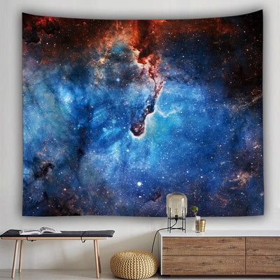 Rectangular tapestry featuring a vibrant blue and orange galaxy print with a nebula and stars, hung on a white wall. - Image 2
