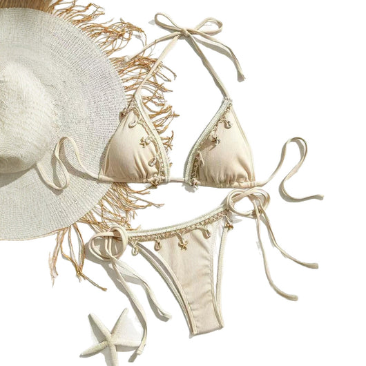 Light pink ribbed halterneck bikini with triangle cups and tie-side bottom, adorned with shell and starfish charms. - Image 5
