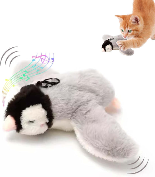 Plush brown and white bird cat toy with yellow accents, a feather tail, and a black clip on its back.