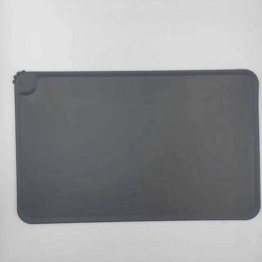 Blue rectangular silicone pet placemat with a raised edge and a small paw print detail in the corner. - Image 10