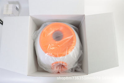 Orange and white pet intelligence ball dispenser with three foam balls, designed as a dog toy. - Image 16