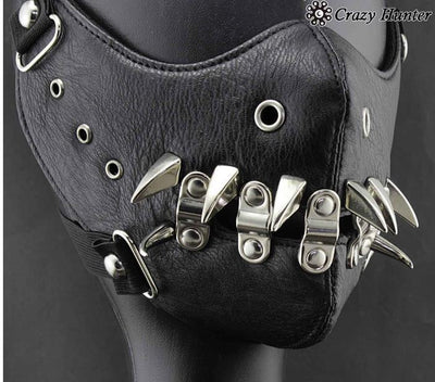 Black leather half-face mask with brass chains, spikes, and gear accents, featuring adjustable elastic straps. - Image 2
