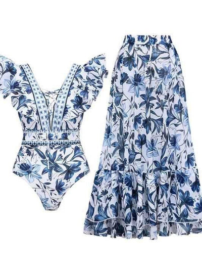 Women's blue and white floral one-piece swimsuit with ruffled V-neck and matching sarong skirt with bow. - Image 6