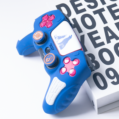 Blue silicone controller cover with white accents and wolf graphic, paired with thumb grips featuring handprint and gear designs. - Image 5