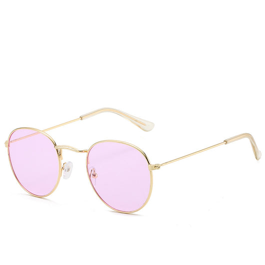 Round gold-framed sunglasses with pink tinted lenses, featuring clear temple tips. - Image 7