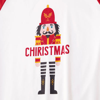 Matching family Christmas pajamas with white raglan tops, red sleeves, and a nutcracker graphic, paired with red, green, and white striped pants. Includes adult - Image 4