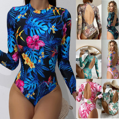 Women's pink long-sleeve one-piece swimsuit with a vibrant tropical leaf and floral print. - Image 17