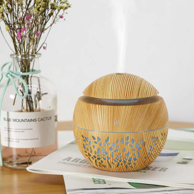 Dark wood grain mini ultrasonic humidifier with a mushroom shape and decorative hollow-out pattern. - Image 14