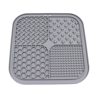 Gray silicone pet licking pad with four textured sections, designed for slow feeding and anti-choking. - Image 33
