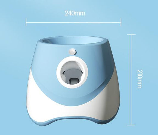 Two automatic dog ball throwers, one yellow and white, one green and white, on a wooden desk. - Image 6