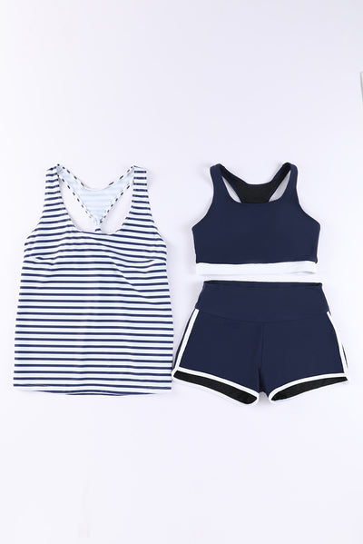 Women's navy blue three-piece high elastic bikini suit with racerback tankini top and swim shorts with white trim. - Image 42