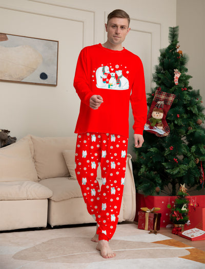Young child wearing a red two-piece pajama set with a polar bear family graphic and snowflake print. - Image 7