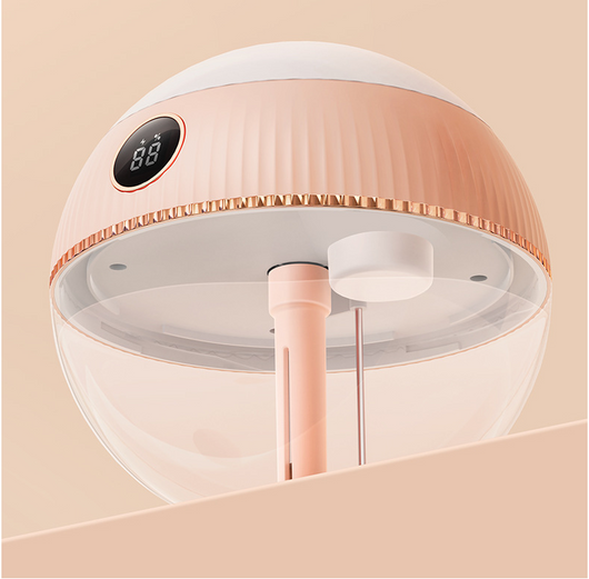 Pink spherical humidifier with a white top, ribbed texture, rose gold band, and a digital display showing 73%. - Image 15