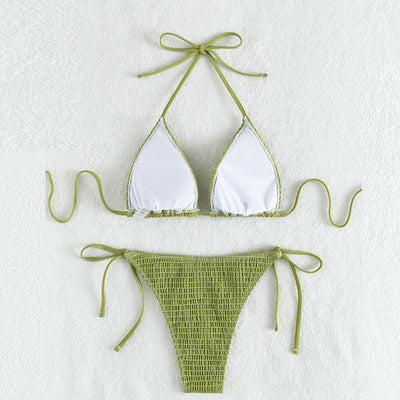 Women's lime green halter bikini with spaghetti straps and thong bottom, modeled outdoors against a blue sky. - Image 3