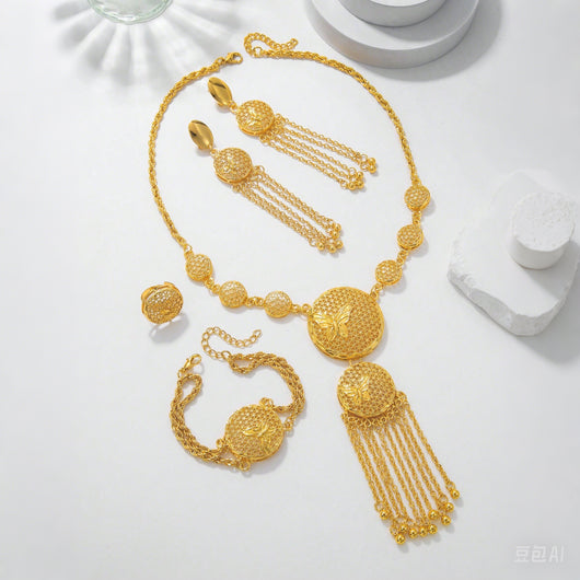 Gold butterfly jewelry set with filigree design, including a necklace, tassel earrings, bracelet, and ring. - Image 8